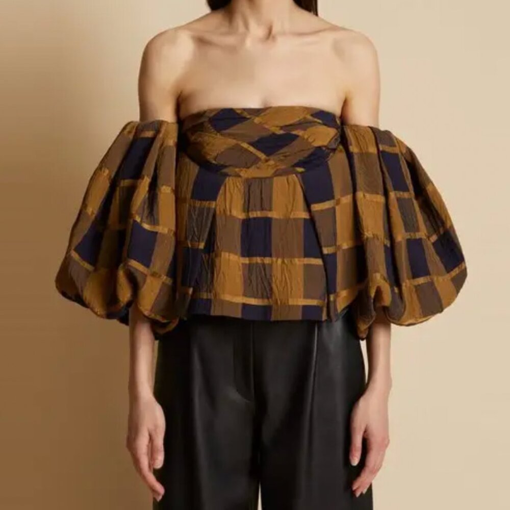 Khaite Katerina off-the-shoulder top in black and gold plaid